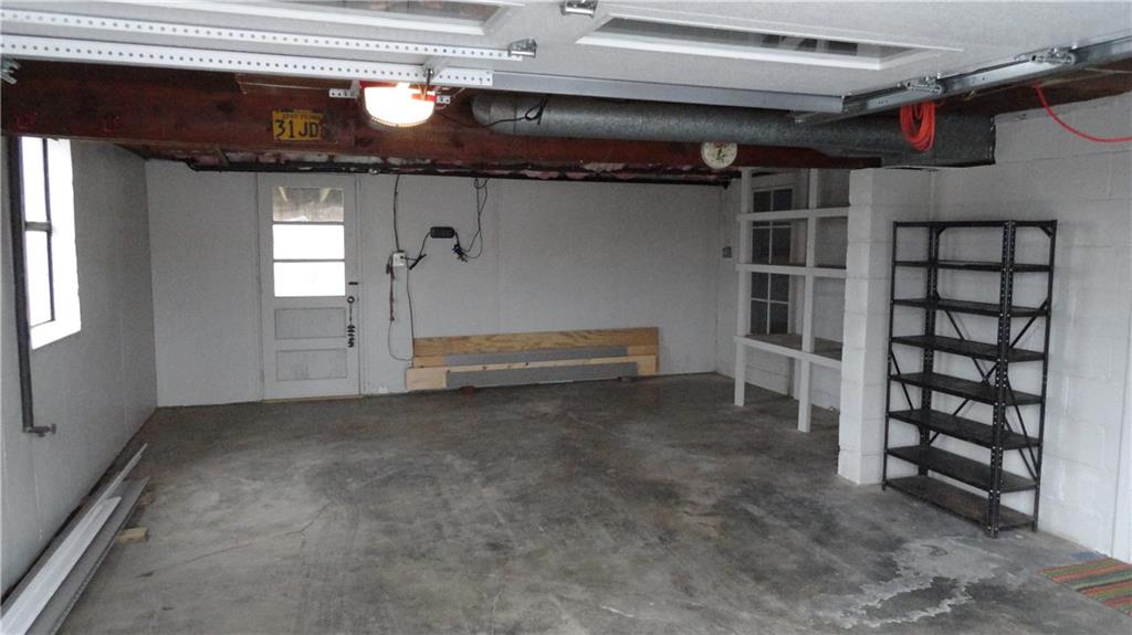 212 North Duffy Road Butler, PA 16001 - Photo 24 of 25 One car Garage, walks out into backyard. Lots of storage and shelving space.