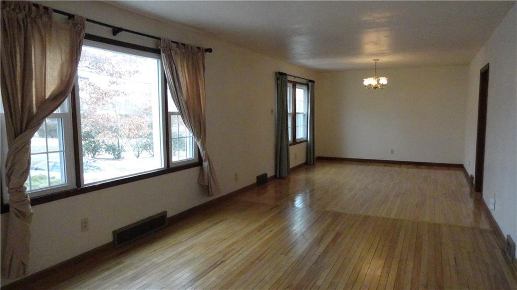 212 North Duffy Road Butler, PA 16001 - Photo 7 of 25 Living Room (17x11) into Dining Room (16x11), Hardwood, 6 month old Vista Windows, bright, sunny, and open space.
