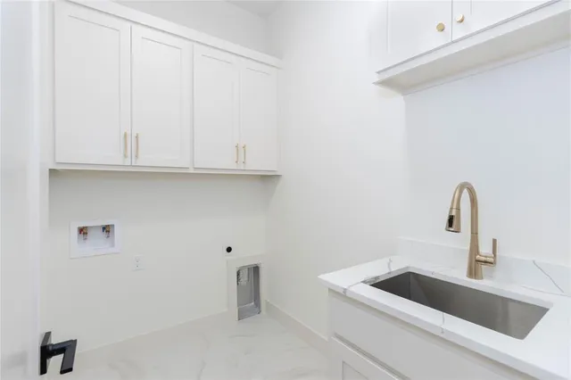 a kitchen with a sink and cabinets
