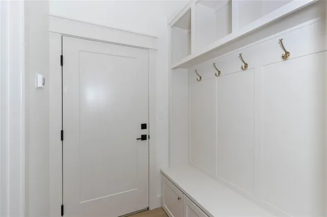 a bathroom with a shower and a sink