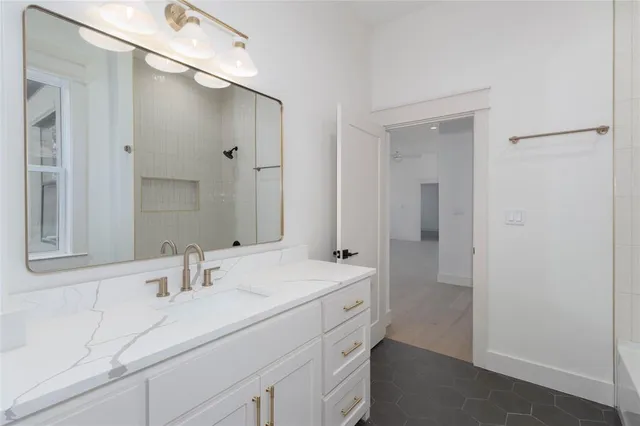 a bathroom with a sink double vanity and a mirror