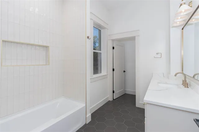 a bathroom with a sink and a bathtub