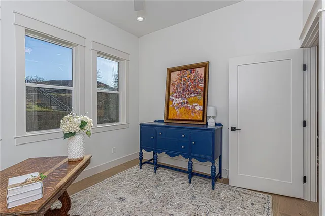 a room with furniture piano and a window