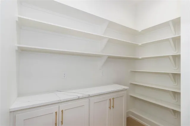 a view of an empty walk in closet