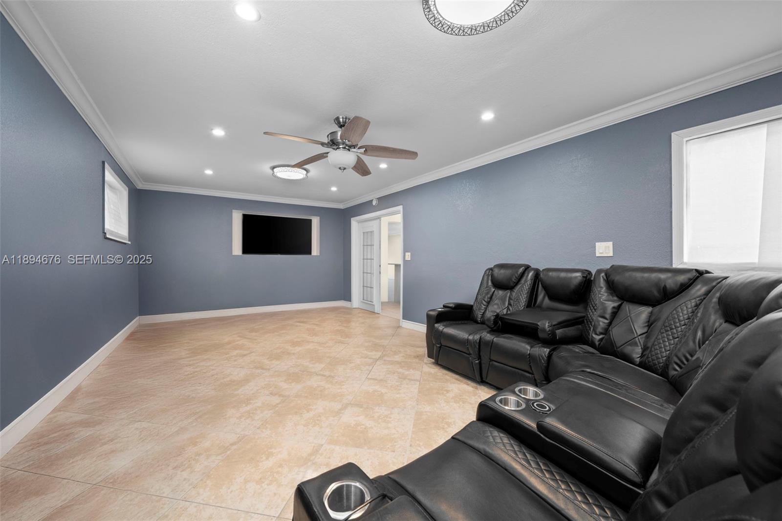1271 Northwest 87th Street Miami, FL 33147 - Photo 13 of 29 a living room with furniture and a flat screen tv
