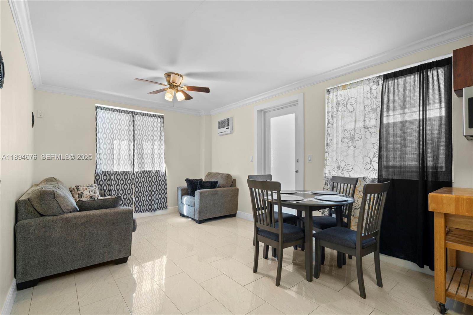 1271 Northwest 87th Street Miami, FL 33147 - Photo 19 of 29 a view of a livingroom with furniture and window