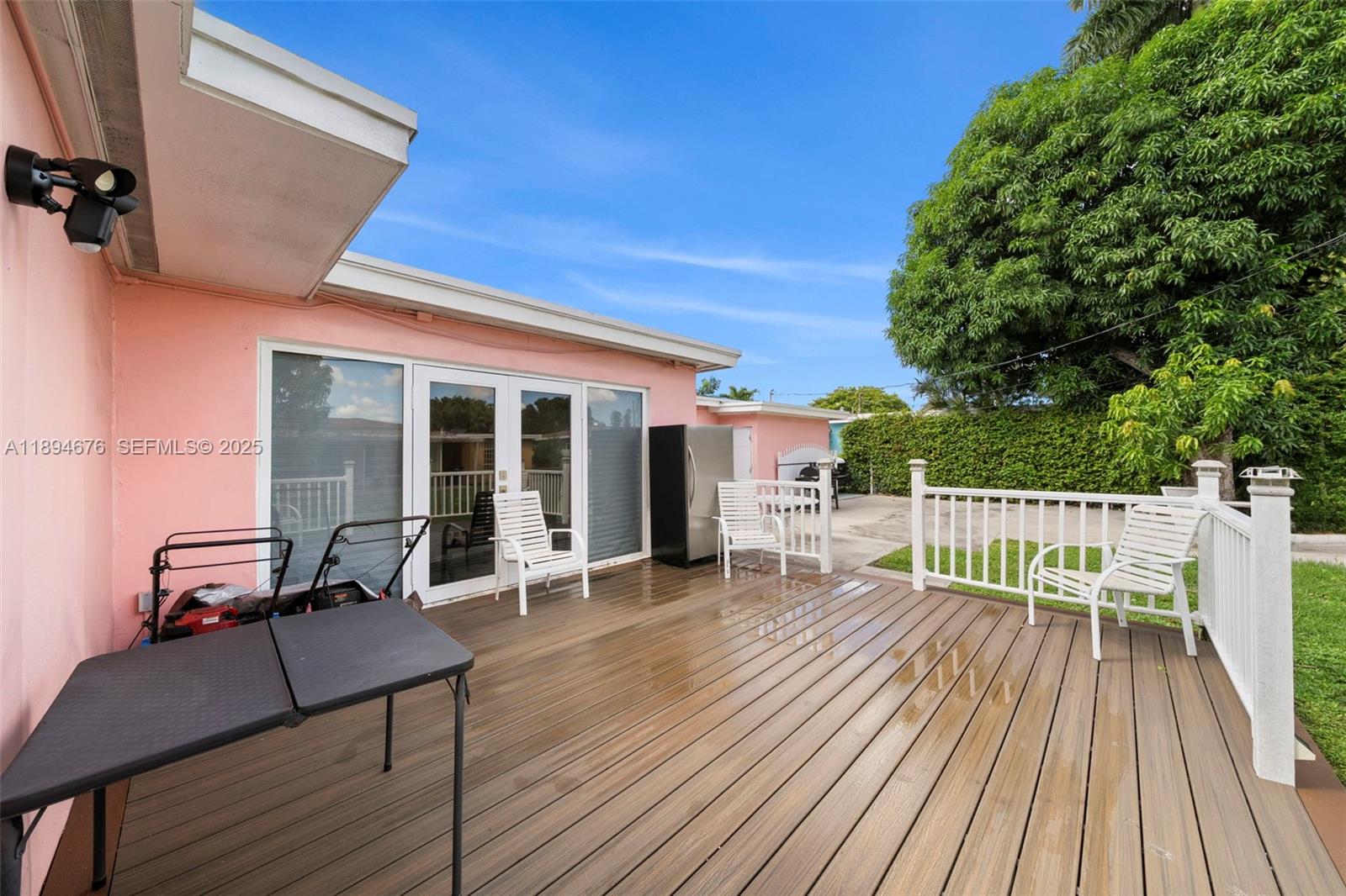 1271 Northwest 87th Street Miami, FL 33147 - Photo 27 of 29 a view of a chair and tables in the balcony