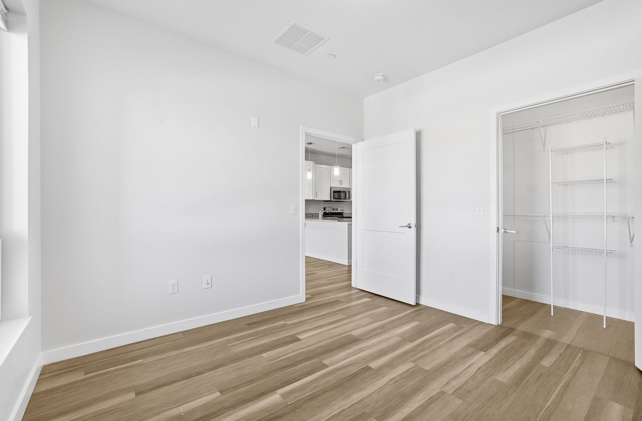71 Connecticut Avenue, Unit 410 Norwalk, CT 06850 - Photo 15 of 17 a view of empty room with wooden floor