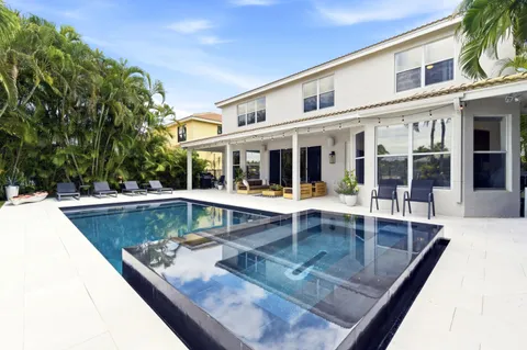 a view of a house with swimming pool