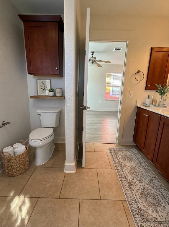 1601 Miriam Avenue, Unit 210 Austin, TX 78702 - Photo 14 of 15 Bathroom featuring vanity, ceiling fan, and light tile patterned floors
