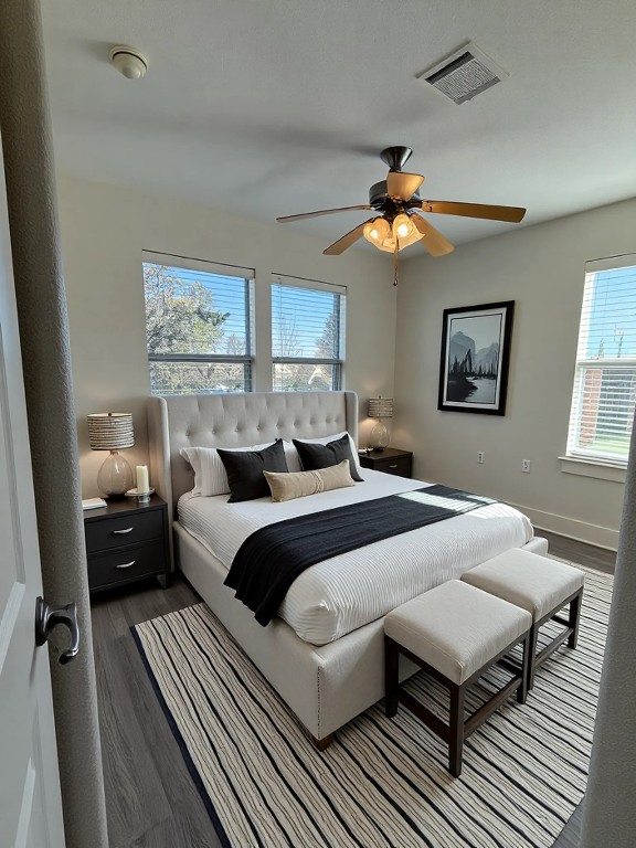 1601 Miriam Avenue, Unit 210 Austin, TX 78702 - Photo 9 of 15 Bedroom featuring wood finished floors and ceiling fan