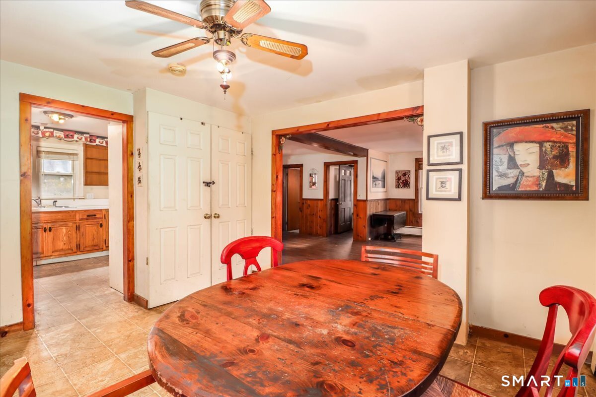 2 Sawmill Road Sherman, CT 06784 - Photo 12 of 40 a bed room with a bed and a chandelier