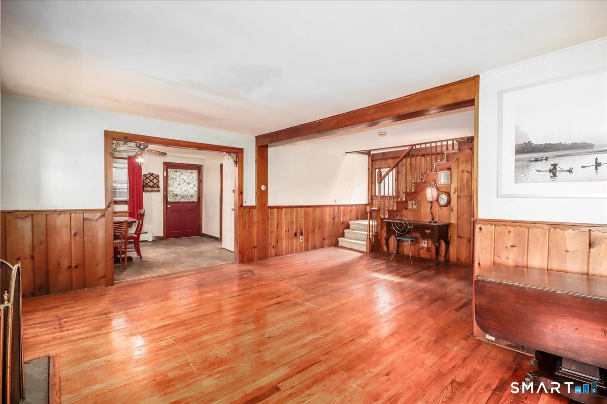 2 Sawmill Road Sherman, CT 06784 - Photo 14 of 40 a living room with furniture and a dining table with wooden floor