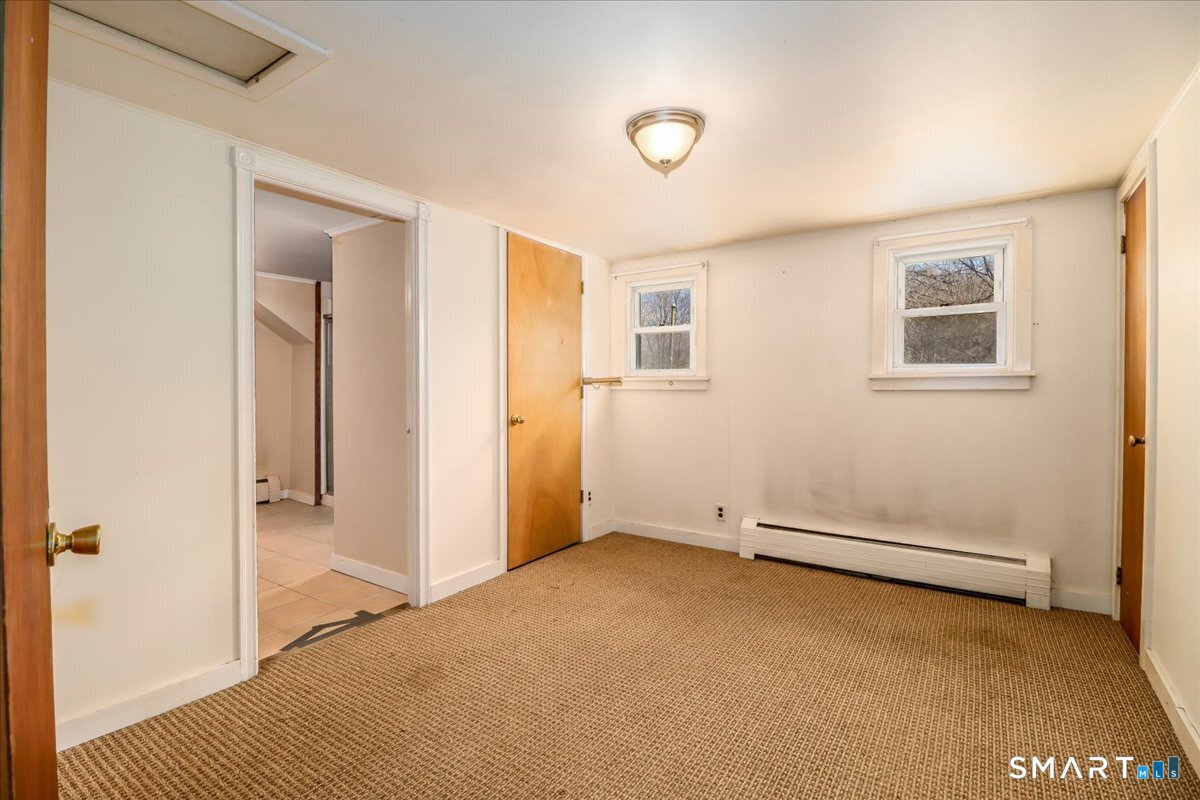 2 Sawmill Road Sherman, CT 06784 - Photo 27 of 40 a view of an empty room with a window