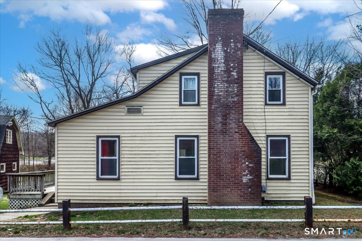 2 Sawmill Road Sherman, CT 06784 - Photo 3 of 40 a view of a house with a yard and large tree