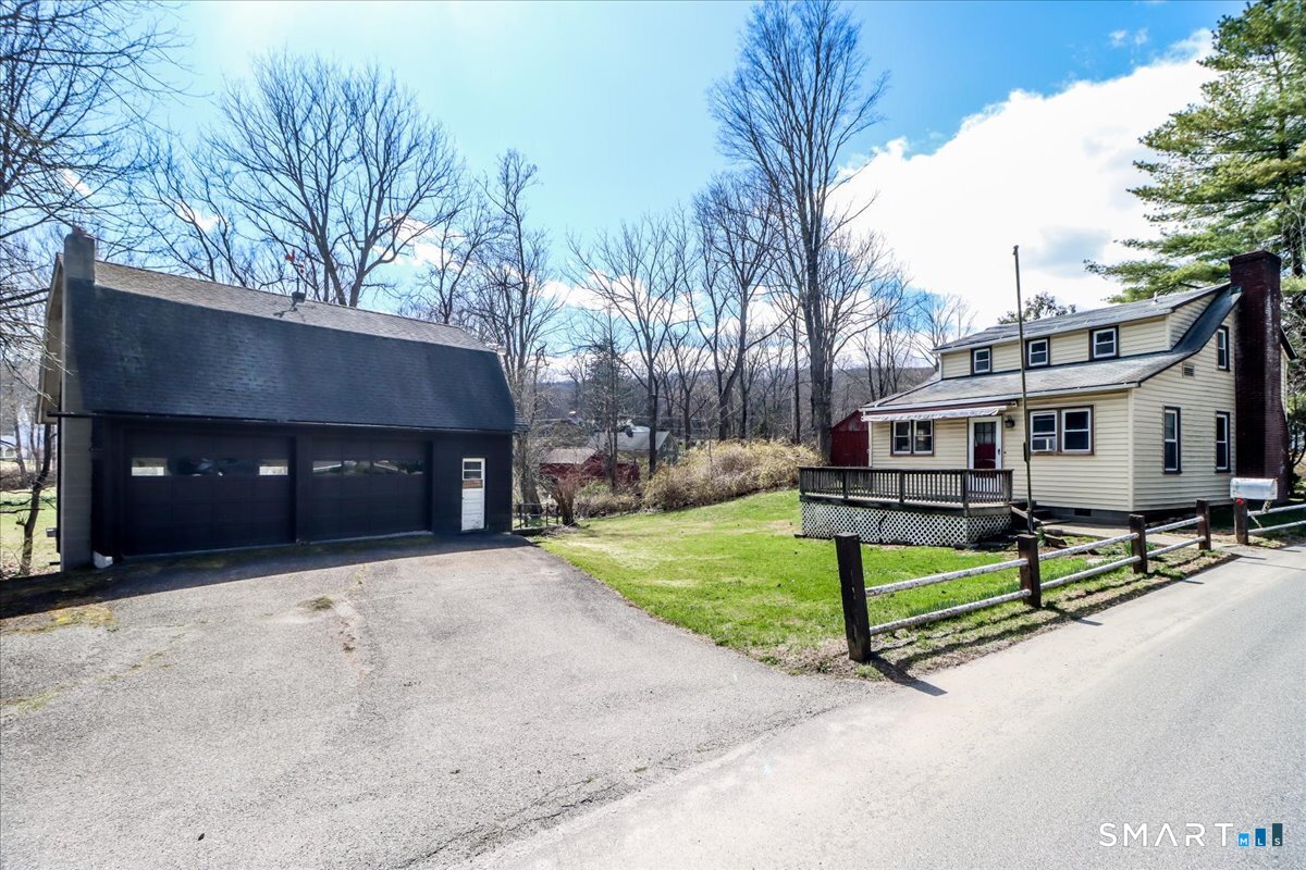 2 Sawmill Road Sherman, CT 06784 - Photo 39 of 40 a front view of a house with a yard