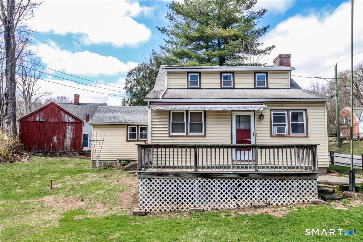 2 Sawmill Road Sherman, CT 06784 - Photo 7 of 40 a front view of a house with a garden