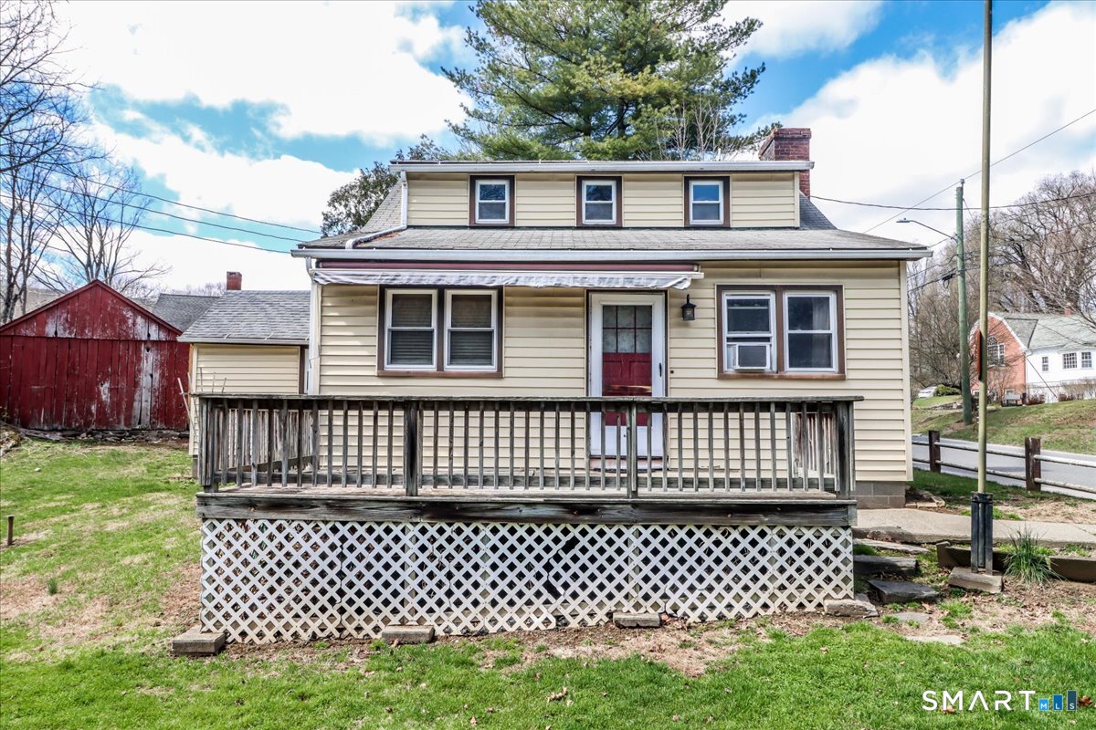 2 Sawmill Road Sherman, CT 06784 - Photo 8 of 40 a front view of a house with a garden