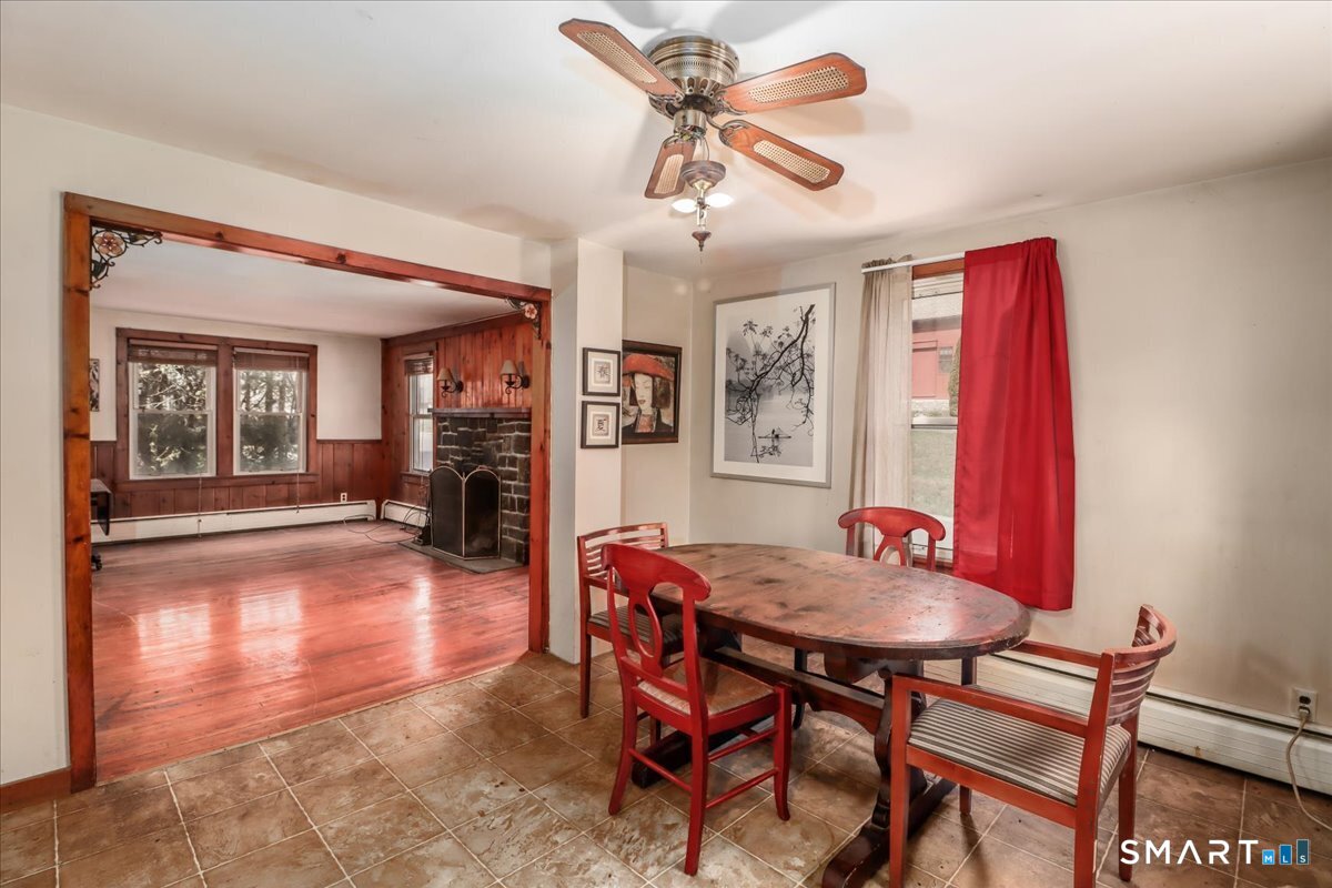 2 Sawmill Road Sherman, CT 06784 - Photo 10 of 40 a view of a dining room with furniture and wooden floor