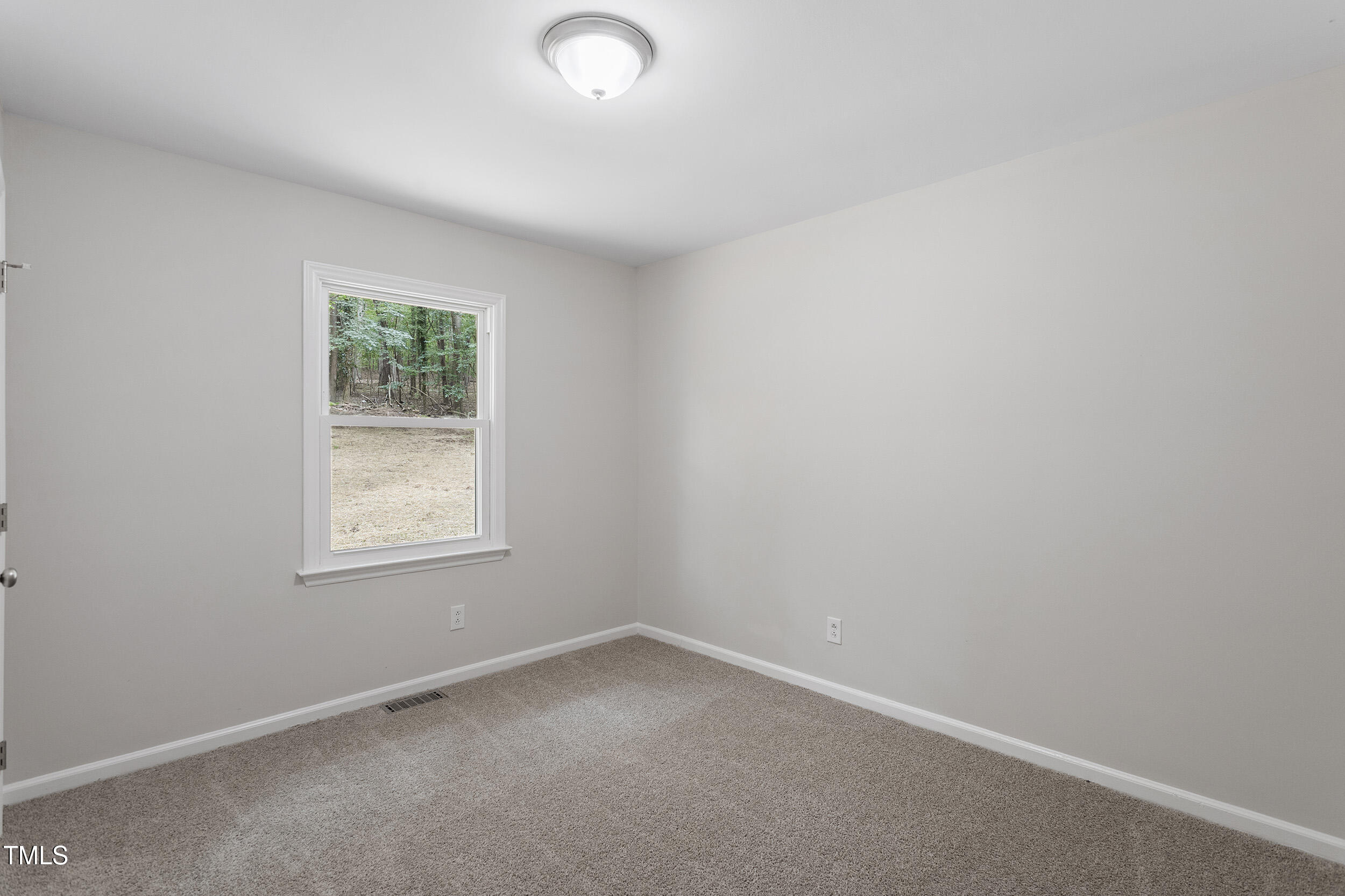 2702 Red Valley Drive Rougemont, NC 27572 - Photo 16 of 25 an empty room with a window