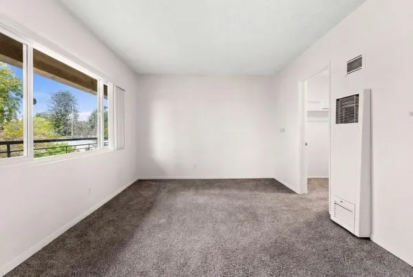 a view of an empty room with a window