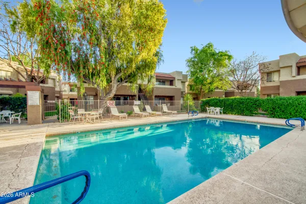 a swimming pool that is in the water next to a building