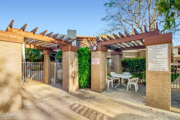 a view of a patio with table and chairs and potted plants
