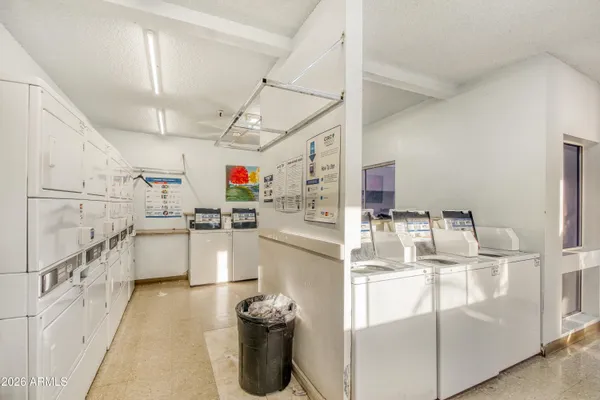 a kitchen with refrigerator and window