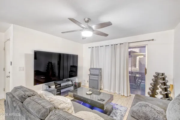 a bedroom with bed furniture and a flat screen tv