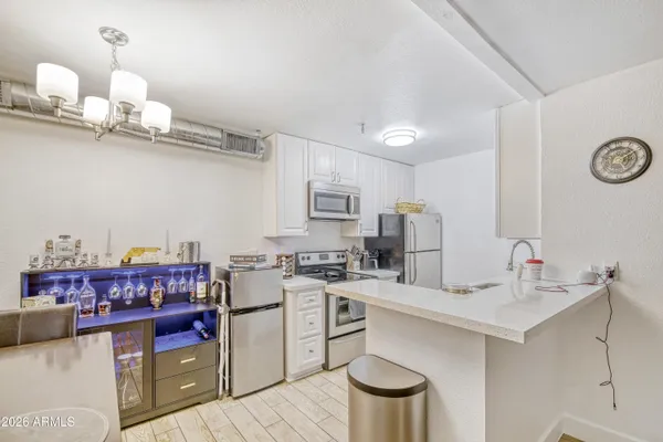 a kitchen with a sink cabinets and window