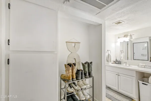 a bathroom with a sink and mirror