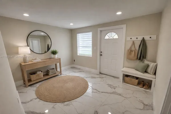 a bathroom with a sink mirror vanity and toilet