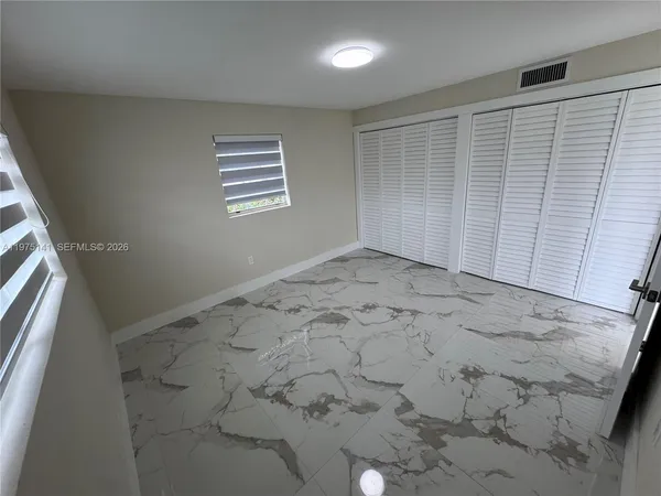 an empty room with a bench