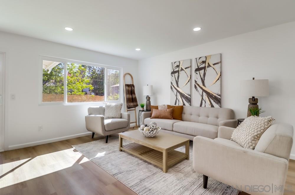 2821 Rosedale Way Spring Valley, CA 91977 - Photo 13 of 70 a living room with furniture and a large window