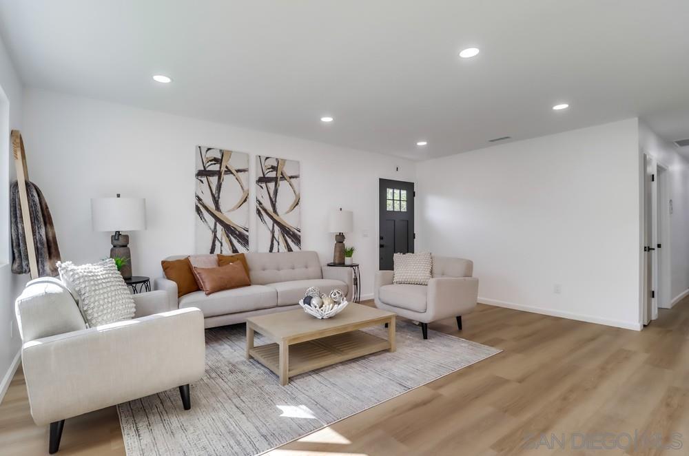2821 Rosedale Way Spring Valley, CA 91977 - Photo 14 of 70 a living room with furniture and a ceiling fan