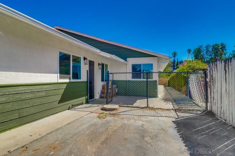 2821 Rosedale Way Spring Valley, CA 91977 - Photo 4 of 70 a view of a house with backyard and a garage