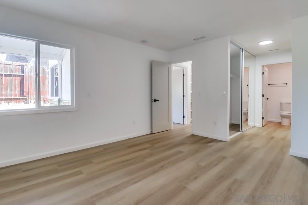 2821 Rosedale Way Spring Valley, CA 91977 - Photo 53 of 70 a view of an empty room with wooden floor and a window