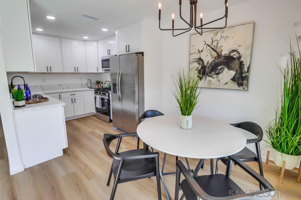 2821 Rosedale Way Spring Valley, CA 91977 - Photo 8 of 70 a kitchen with a table and chairs
