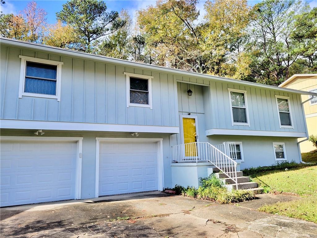 2455 Northbrook Road Snellville, GA 30039 - Photo 1 of 1 a front view of a house with a yard