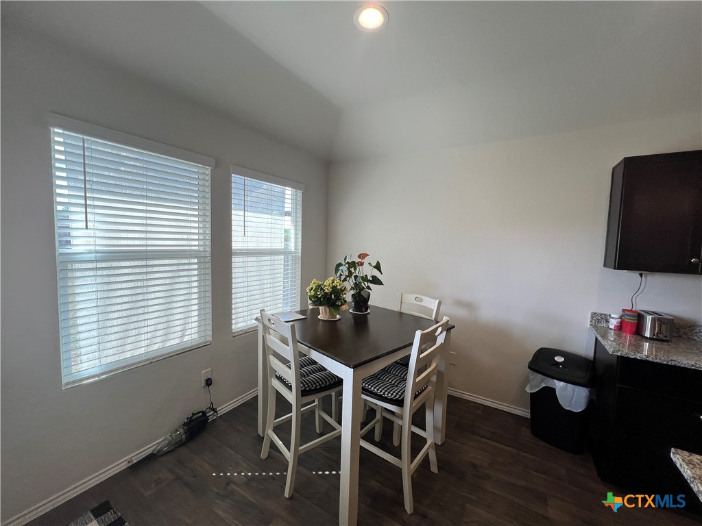 809 Margay Loop Seguin, TX 78155 - Photo 14 of 20 a dining room with furniture and wooden floor