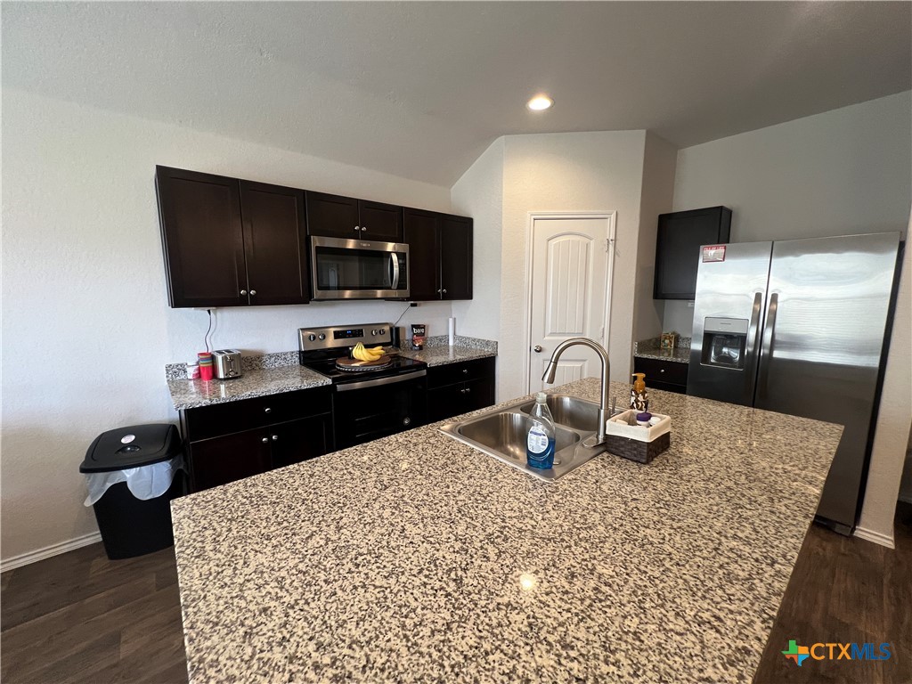 809 Margay Loop Seguin, TX 78155 - Photo 15 of 20 a kitchen with a sink appliances and cabinets