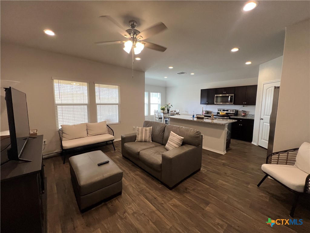 809 Margay Loop Seguin, TX 78155 - Photo 18 of 20 a living room with furniture and a flat screen tv