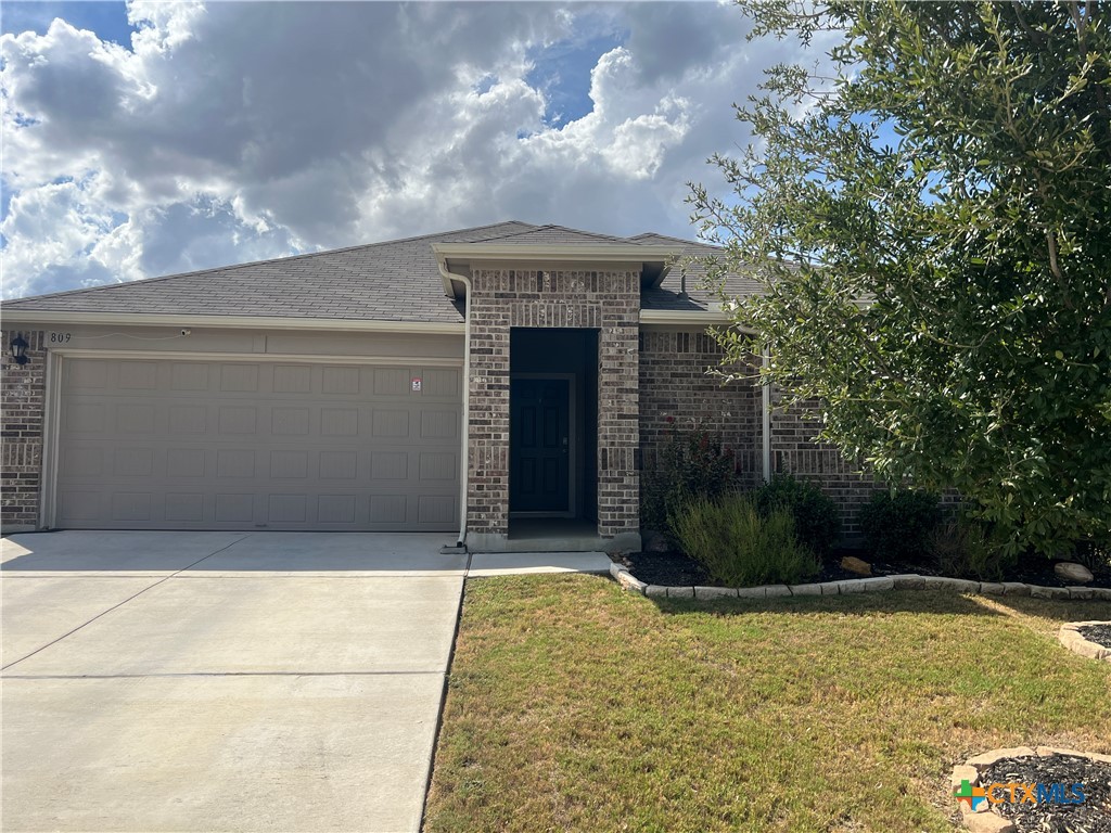 809 Margay Loop Seguin, TX 78155 - Photo 2 of 20 a front view of a house with a yard