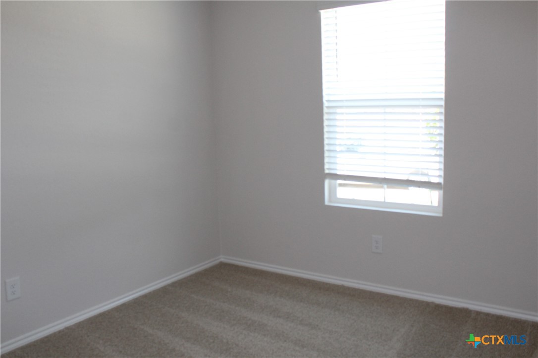 809 Margay Loop Seguin, TX 78155 - Photo 4 of 20 an empty room with a window