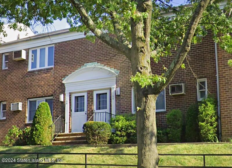166 Arlo Road, Unit A Staten Island, NY 10301 - Photo 1 of 21 a front view of a house with garden