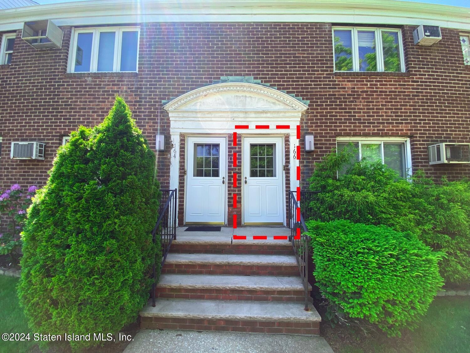166 Arlo Road, Unit A Staten Island, NY 10301 - Photo 3 of 21 a front view of a house with a yard