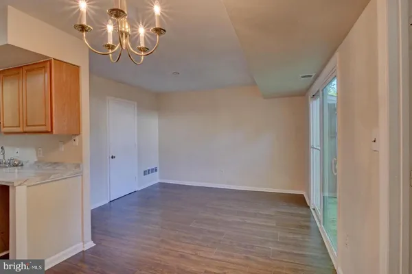 a view of a storage & utility room with wooden floor