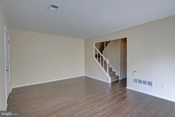 a view of an entryway with wooden floor