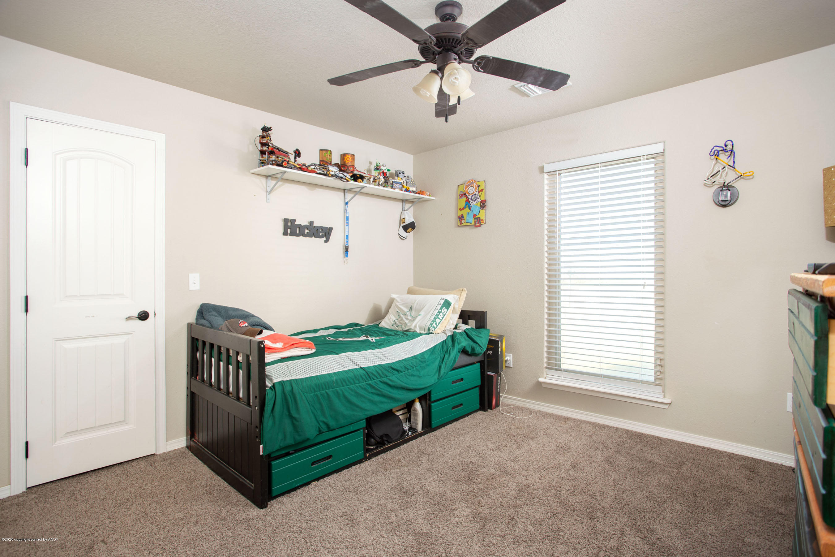 14901 Helium Road Amarillo, TX 79119 - Photo 22 of 30 a bedroom with a bed and a window