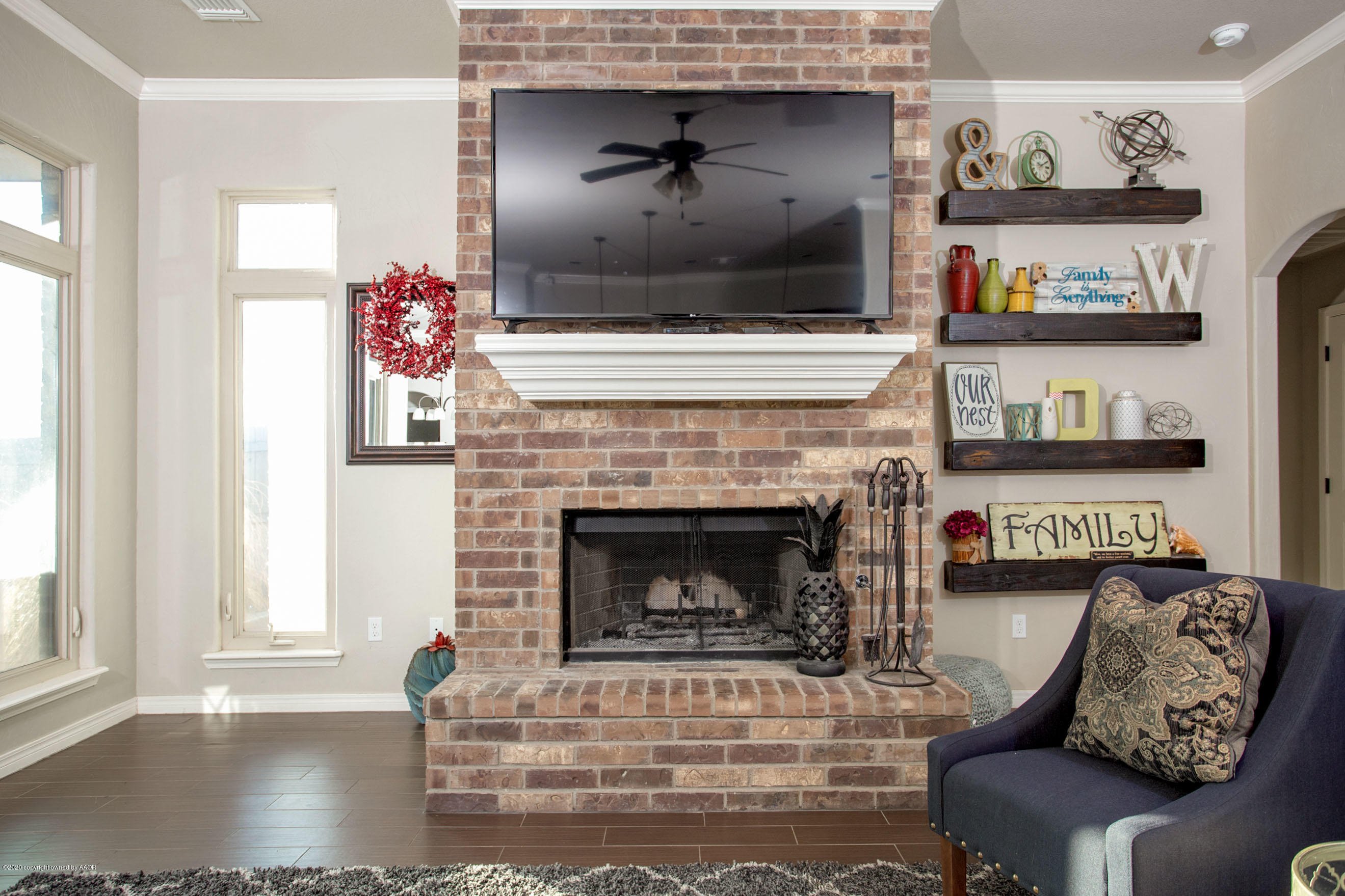 14901 Helium Road Amarillo, TX 79119 - Photo 7 of 30 a living room with furniture and a fireplace